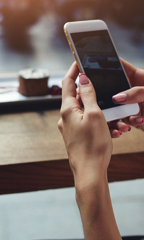 Woman looking at engaging content on a mobile phone